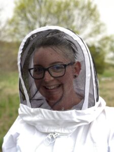 Closeup of Rae Olson in a bee suit