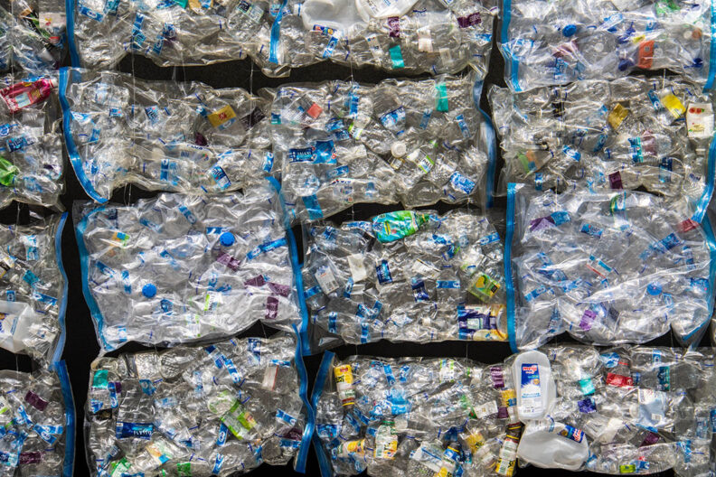 Part of a wall in the centre of Singapore, made out of plastic wastee in vacuum sealed bags