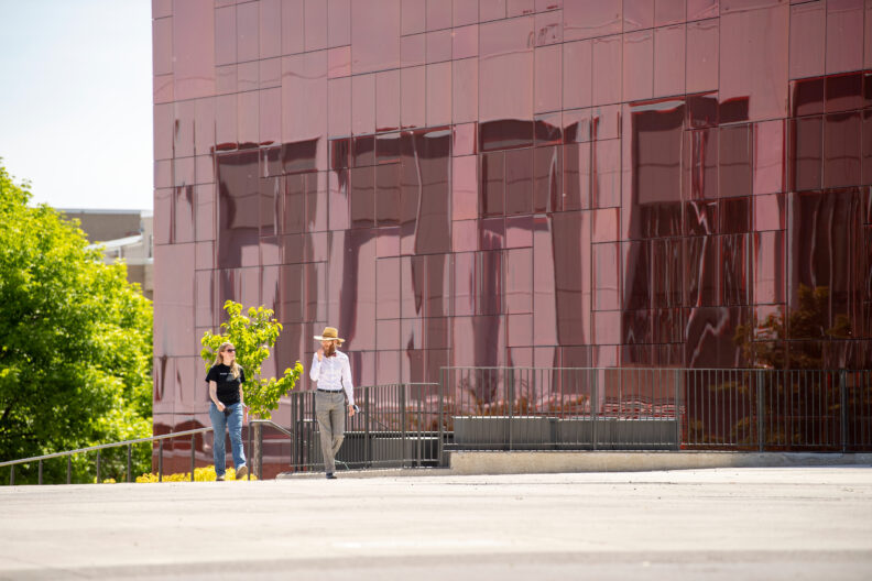 Two people walking on the WSU Pullman campus.