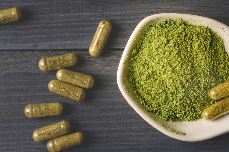 Closeup of powdered krater in a bowl and in pill form