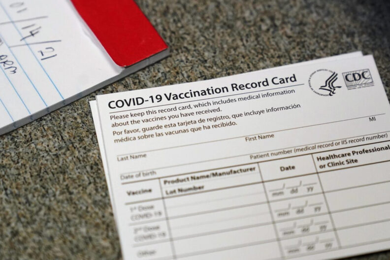 Closeup of a COVID-19 vaccination record card.