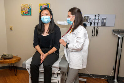 Two students learn and practice in one of WSU Health Sciences' simulation spaces.