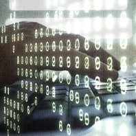 A image of graphic numbers and a closeup of a laptop being used in the background