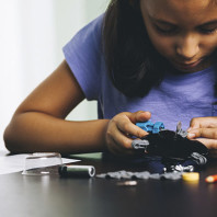 A closeup of a kid working on science