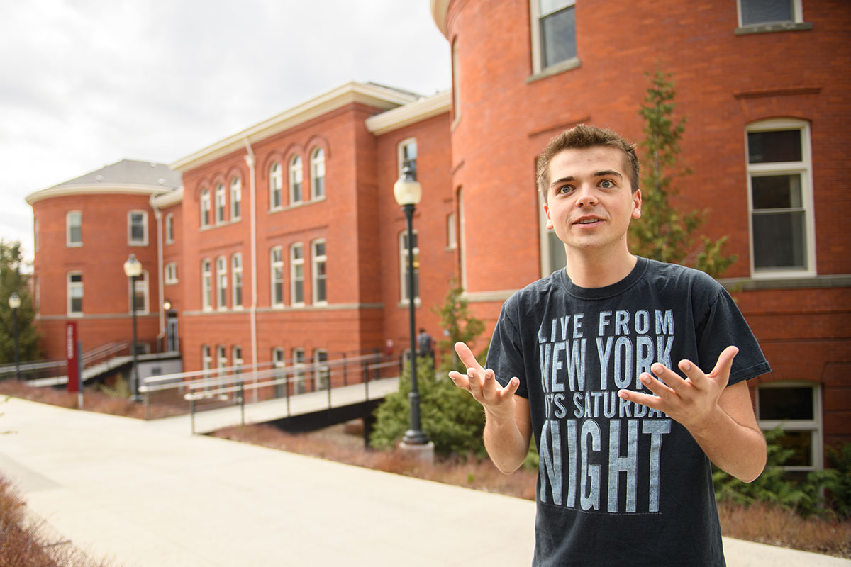 Jake standing outside Murrow Hall with a quizzical look on his face.