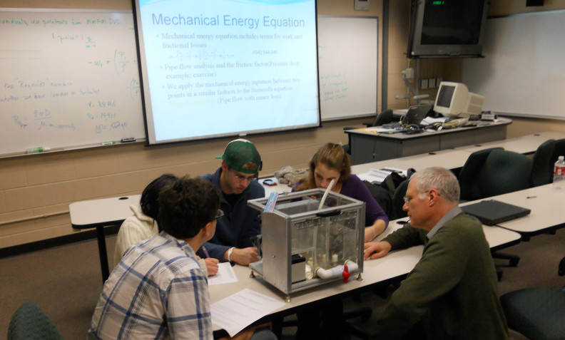Bernie Van Wie works with students using the Desktop Learning Module (DLM) developed by then PhD student, now Postdoctoral Research Associate, Paul Golter
