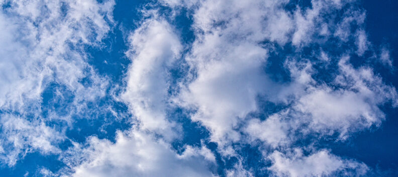 Blue sky with scattered clouds