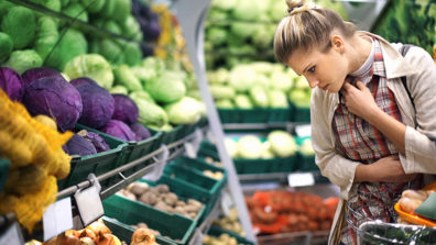Person shopping for produce at the grocery store
