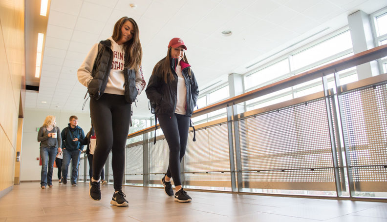 Students walking in the hall in Goertzen Hall