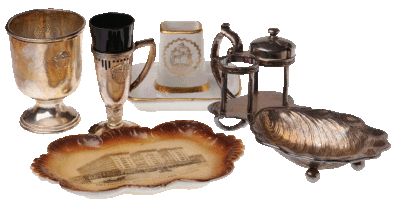 The Westin Hotels collection in WSU's archives holds some rare and beautiful pieces including, from left to right, a silver vessel and egg cup from the Davenport Hotel, a plate from the Multnomah Hotel, a 1930s cigarette holder and ashtray from the Olympic Hotel, and an oyster shell-shaped condiment tray from the Multnomah.
